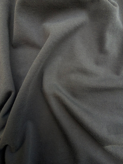 Close-up of dark gray fabric with folds
